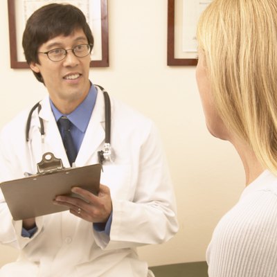 Male doctor talking to a female patient