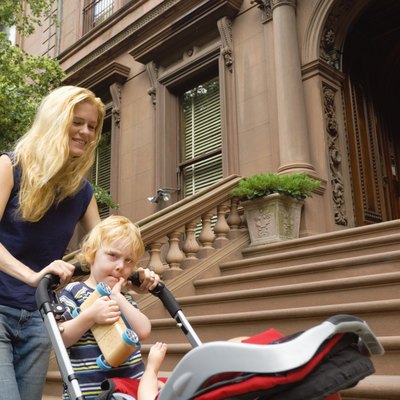 Mother and son pushing stroller