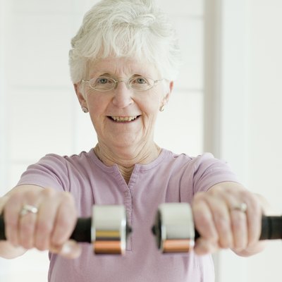 Senior woman lifting free weights
