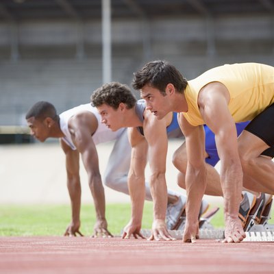 Athletes crouching at starting line