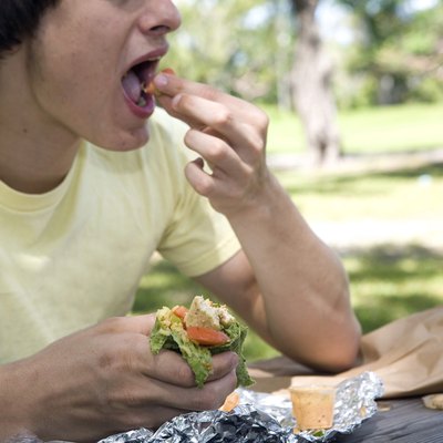Close-up of a young man eating
