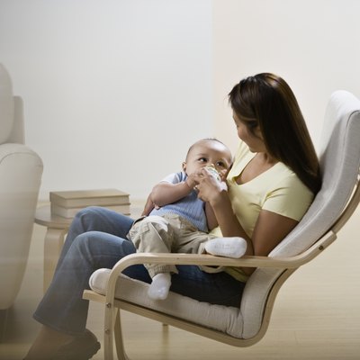 Asian mother feeding baby