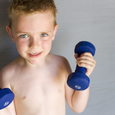 Boy lifting dumbbells