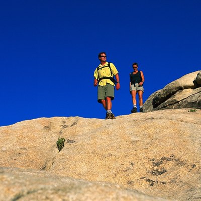 low angle view of a couple walking down a rock