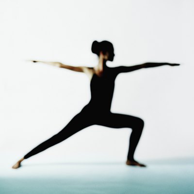 Woman in warrior II yoga position