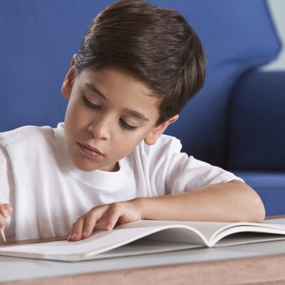 Boy studying in livingroom