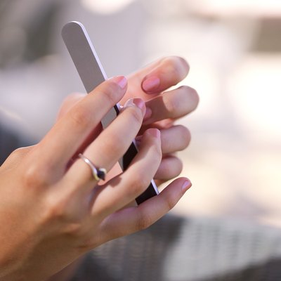 Hands with nail file