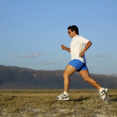 Man running with mountains, California, USA