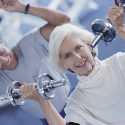 Senior couple exercising in a health club