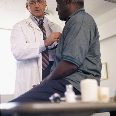 Male doctor examining a male patient