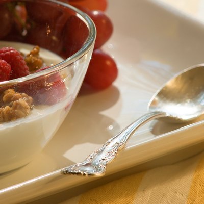 Bowl of yogurt with nuts and berries