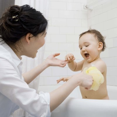 Mother giving son a bath
