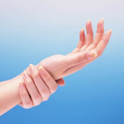 Woman putting her wrist on the other hand