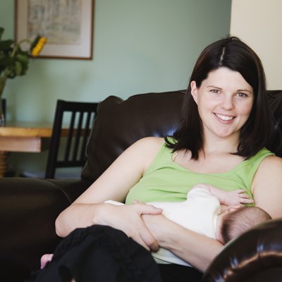 Mother holding newborn baby girl