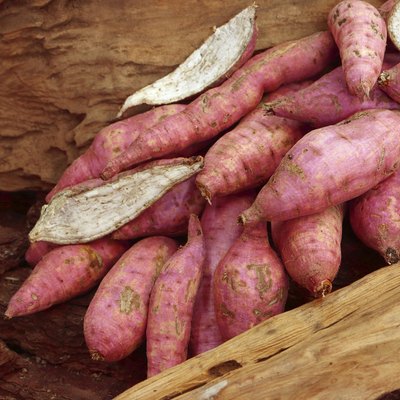 Old potatoes on wooden