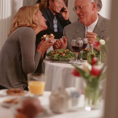 Mature couple sitting in restaurant, talking