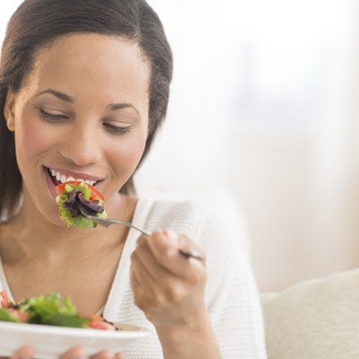 Woman Eating Fresh Salad At Home