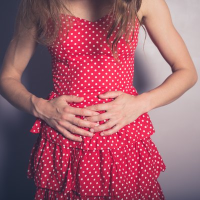 Young woman with a belly ache