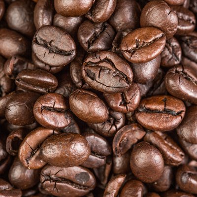 Coffee bean on grunge wooden background