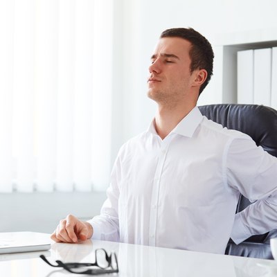 Young businessman has backache