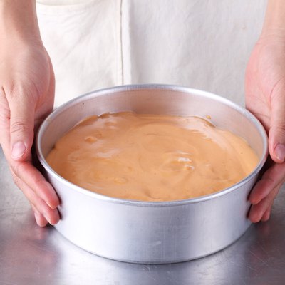 woman holds cake pan