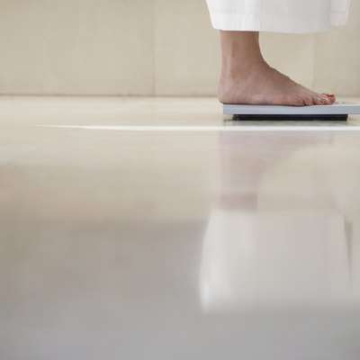 Woman Standing On Weighing Scale