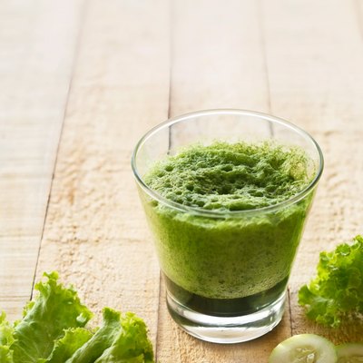 smoothie detox lettuce and cucumber on wooden background