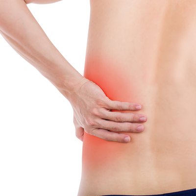 Close up male back pain isolated white background.