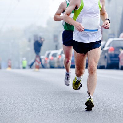 People running in city marathon