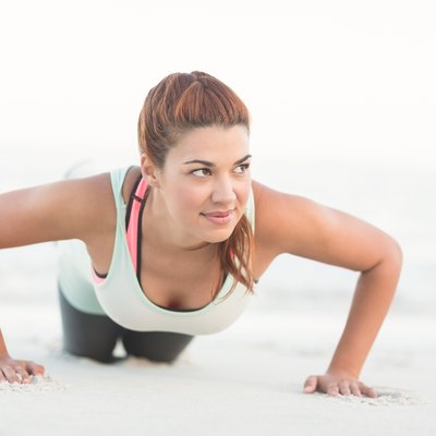 Beautiful brunette doing push ups