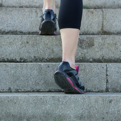 Young sport woman walking upstairs in gym shoes