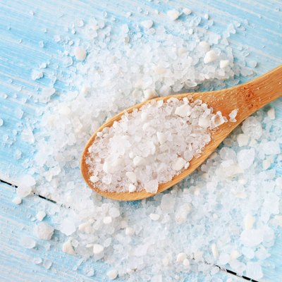 Sea salt on wooden table wooden spoon