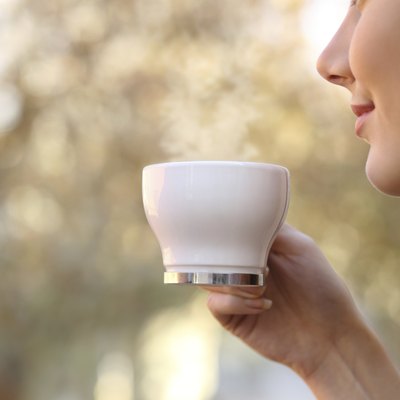 Woman holding a coffee cup