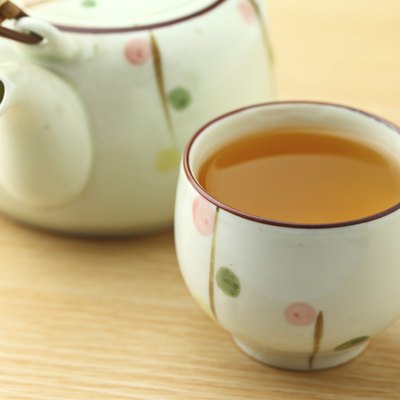 Cup of tea with teapot