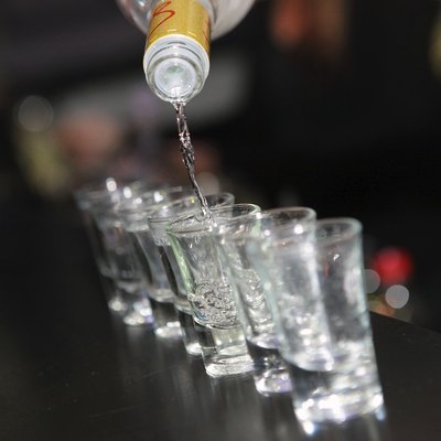 shot glasses of vodka on the bar counter