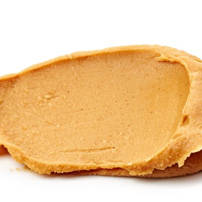 peanut butter spread isolated on white