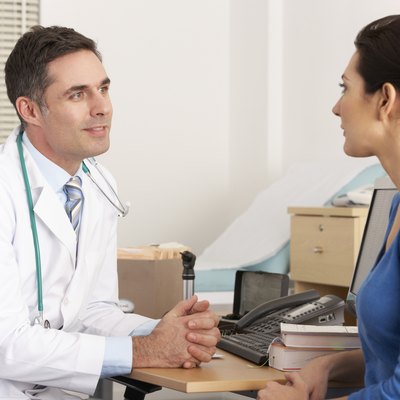 American doctor talking to woman in surgery