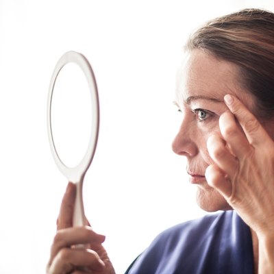 Mature woman and face care