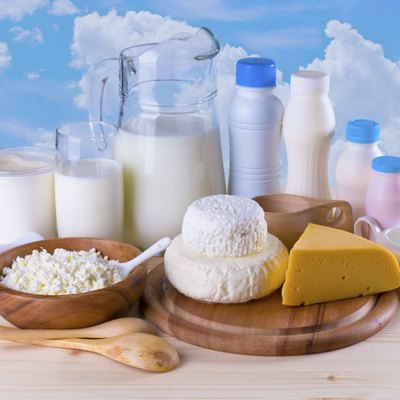 Composition of dairy products on sky background
