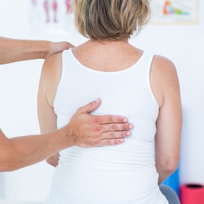 Doctor examining his patient back