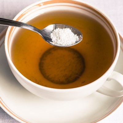 Tea with sweetener in a spoon