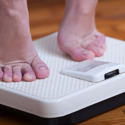 Womans feet and time for weight truth from a scale