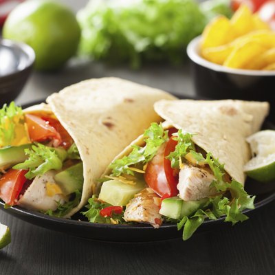 mexican tortilla wrap with chicken breast and vegetables