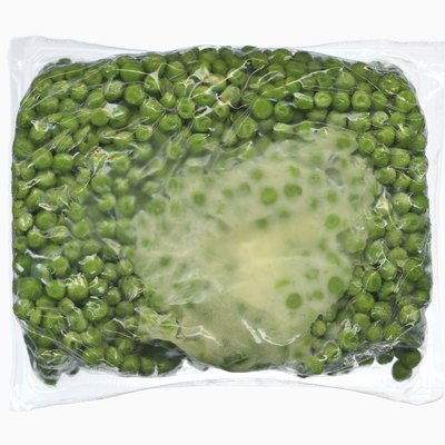 Vacuum packed block of frozen peas