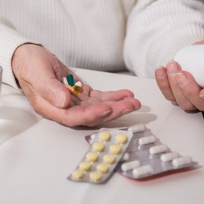 Senior man taking medicament