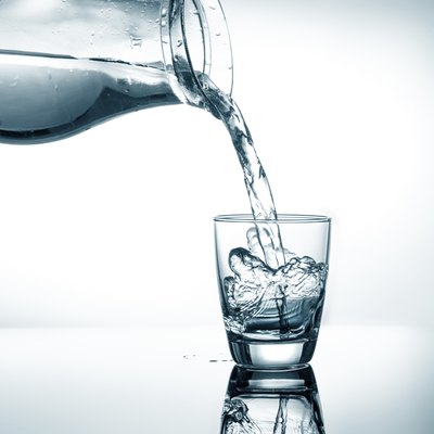 Filling in glass of water