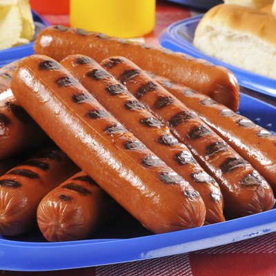 Picnic plate of grilled hot dogs