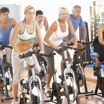 Group Of People In Spinning Class At Gym