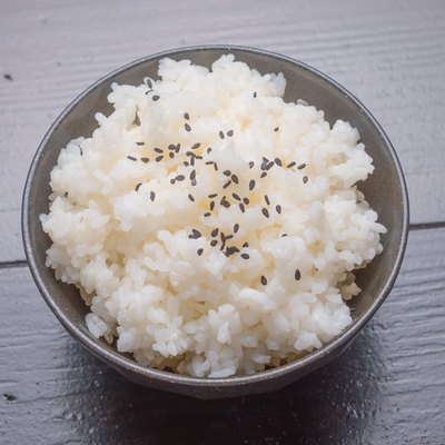 cooked rice with black sesame on bowl