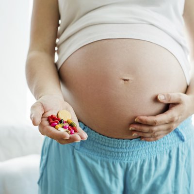 Pregnant woman with pills